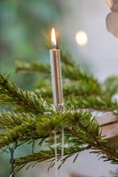Silver candle on Christmas tree 