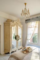 Vintage French wardrobe in classic bedroom 