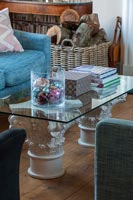 Glass top coffee table with jar of Christmas baubles 