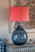 Blue glass lamp with apricot lampshade 