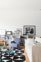 Grey armchair in monochrome modern living room 