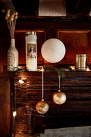 Christmas decorations on wooden mantelpiece