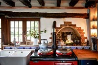 Country kitchen with red Aga stove