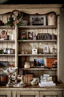 Wooden dresser in country kitchen with Christmas decorations 
