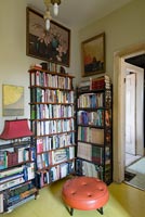 Bookcase in library with yellow painted floor