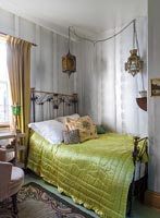 Classic bedroom with iron bedstead 
