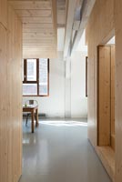 Wooden clad walls and polished concrete floor 
