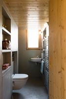 Small wooden clad bathroom 