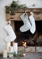 Close up rustic fireplace decorated for Christmas 