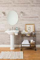 Modern bathroom with trolley for accessories 