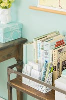 Books and accessories on vintage trolley in study