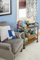 Vintage trolley as side table and storage unit in living room  