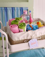 Basket of towels and bath toys and accessories for children 