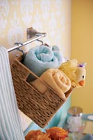 Suspended basket of flannels and bath toys