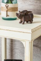 Flying pig ornament on side table 