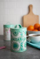 Storage jars covered in classic patterned fabric 