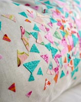 Fabric pieces used to decorate a cushion 