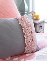Pink frill on purple pillow 
