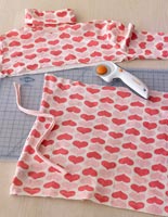 Heart patterned roll neck top on cutting board 