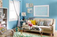 Modern living room with bright blue painted walls 