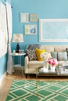 Modern living room with bright blue painted walls 
