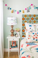 Colourful patterned headboard in modern bedroom 