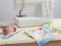Sewing machines with vintage handkerchiefs and sewing accessories 
