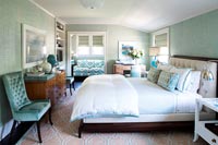 Classic bedroom with teal blue walls and furniture 