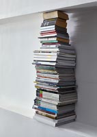 Large pile of books in alcove 