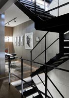 Black metal staircase in modern industrial space 