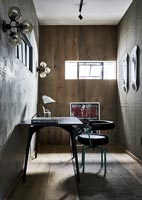 Modern study with wooden and concrete walls 