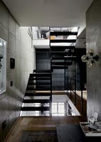 View of black metal staircase in industrial home 