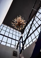 Antler chandelier in modern industrial staircase 