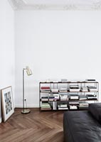 Black and white living room with modern bookshelves 