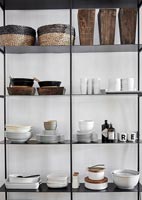 Open shelving filled with plates and crockery 