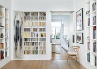 Modern reading room with alcove shelving wall to wall 