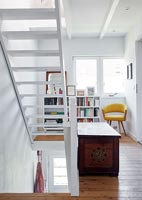Open staircase and reading area on modern landing 