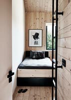 Contemporary childrens bedroom in wooden cabin 