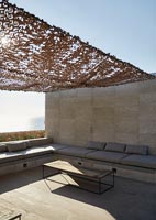 Seating area with fabric canopy and sea view 