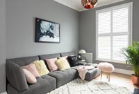 Modern living room with grey painted walls 