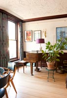 Baby grand piano in classic living room 