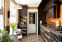 Modern kitchen with original patterned tiled floor