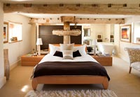 Bedroom with old watermill mechanism and freestanding bath