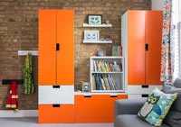 Orange wardrobe unit in modern childrens bedroom 