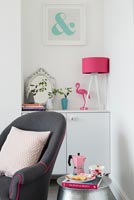 Pink lamp and accessories in modern living room 