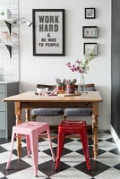 Wooden dining table and mismatched seating in modern kitchen-diner