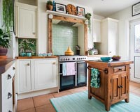 Small wooden island in country kitchen 