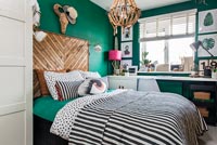 Modern bedroom with green painted walls