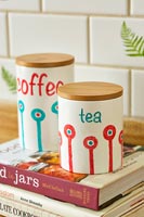 Tea and coffee storage jars in kitchen 