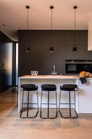 Contemporary kitchen with lights on 